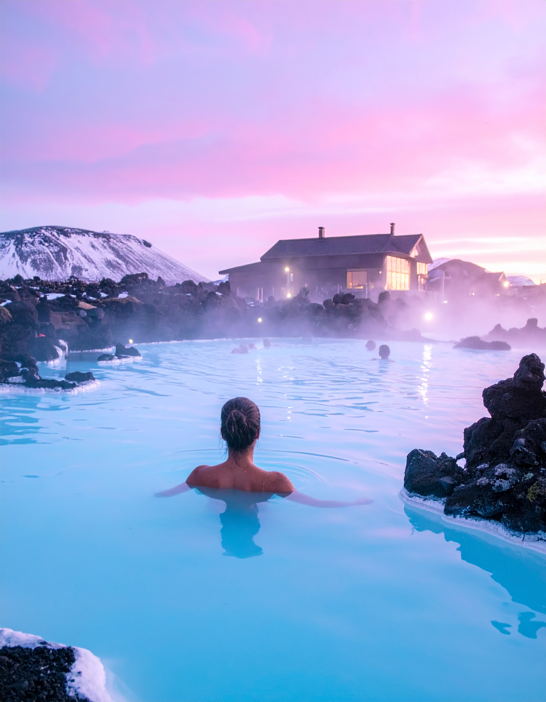 Luxury geothermal spa in Iceland with people relaxing in mineral waters